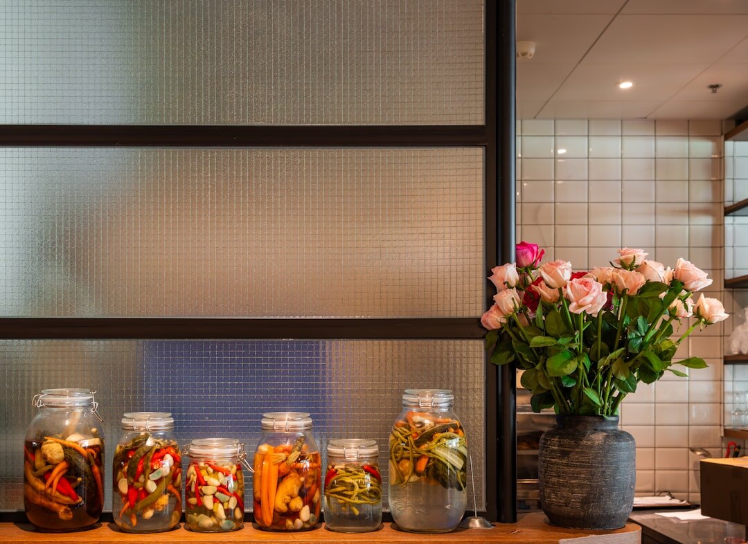 Fresh seasonal vegetables and herbs on a wooden kitchen counter