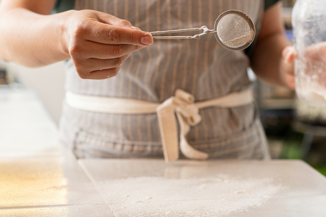 Woman kneading dough in a bright Czech home kitchen