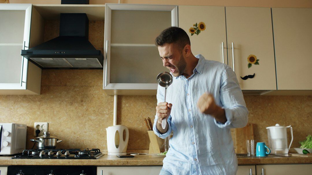 Portrait of a Czech man cooking editor in a kitchen